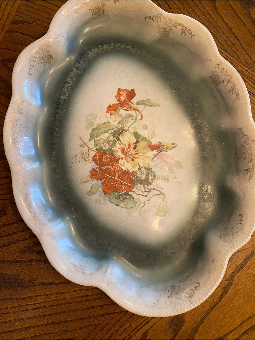 Floral porcelain  oval Serving platter look at pictures it a chip in and back